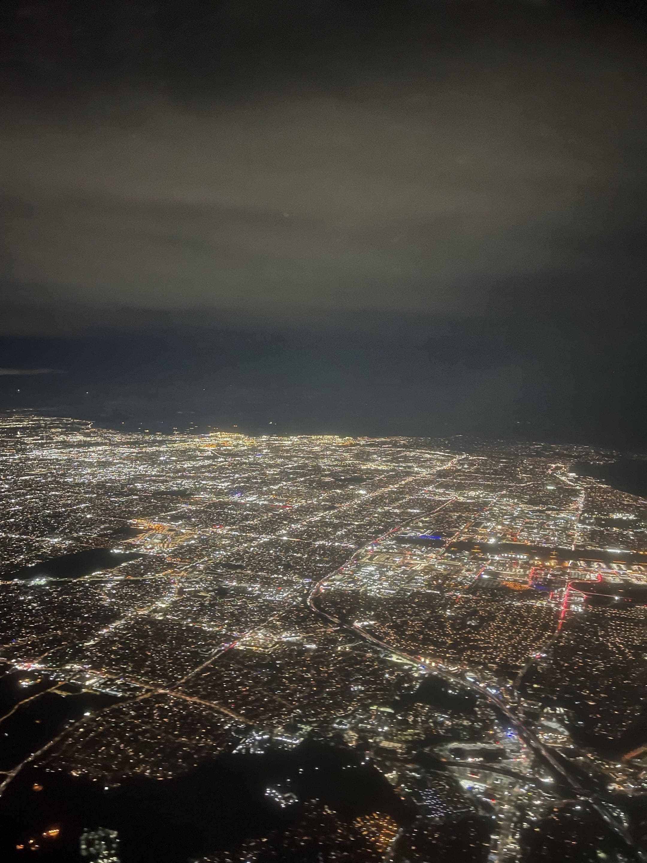 City lights seen from a plane window at night