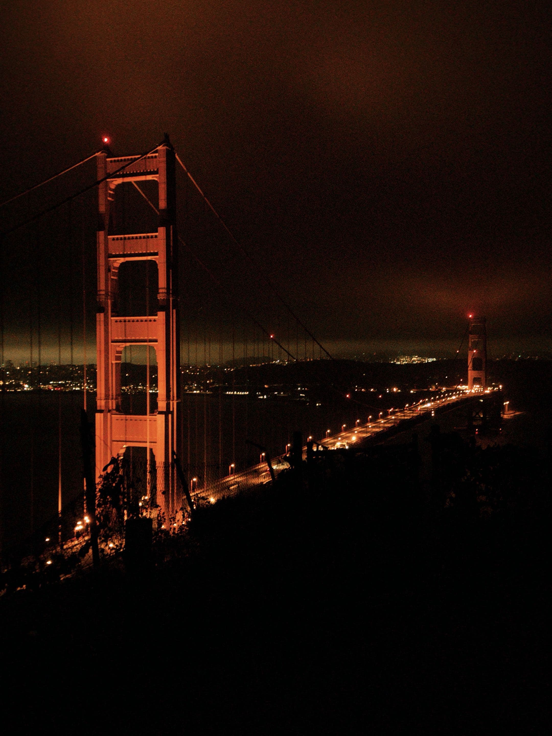 The Golden Gate Bridge lit up at night